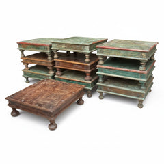 A set of rustic, multi-tiered wooden side tables or end tables with distressed green and brown paint, shown on a clean white background.