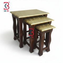 KB ART vintage brass coffee stools spread out in a cozy living room setup, holding books, a warm tea mug, and a small decorative vase.