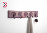 KB ART Purple Wheel Carved Wooden Wall Hook Rack - Front View of Handcrafted Detailing - Handcrafted Wooden Decor Jodhpur