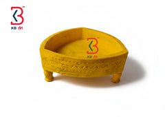 Yellow decorative item with a brand logo on a white background