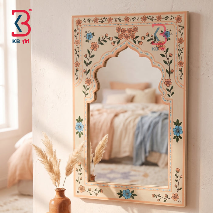 Peach cream hand-painted wooden Jharokha arch wall mirror with peach and blue botanical floral border on white background