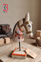 KB ART traditional hand-carved wooden horse head statue with an antique white crackle finish and hand-painted golden harnesses mounted on a square block stand.