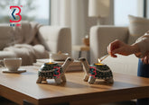 Two turtle-shaped candle holders on a table with a hand lighting them, in a living room setting.
