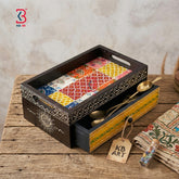 Real product photograph on a white background showing a dark brown handmade wooden serving tray with its hand-painted yellow drawer slightly open, by KB Art.