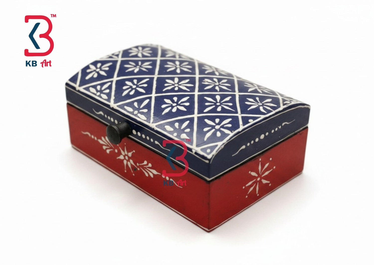 A decorative rectangular keepsake box with a navy blue lid featuring a white geometric floral pattern and a red base with white floral motifs, shown on a white background.