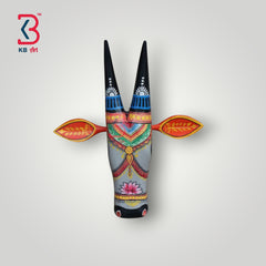 Hand-painted wooden cow head wall art with intricate designs and black horns.