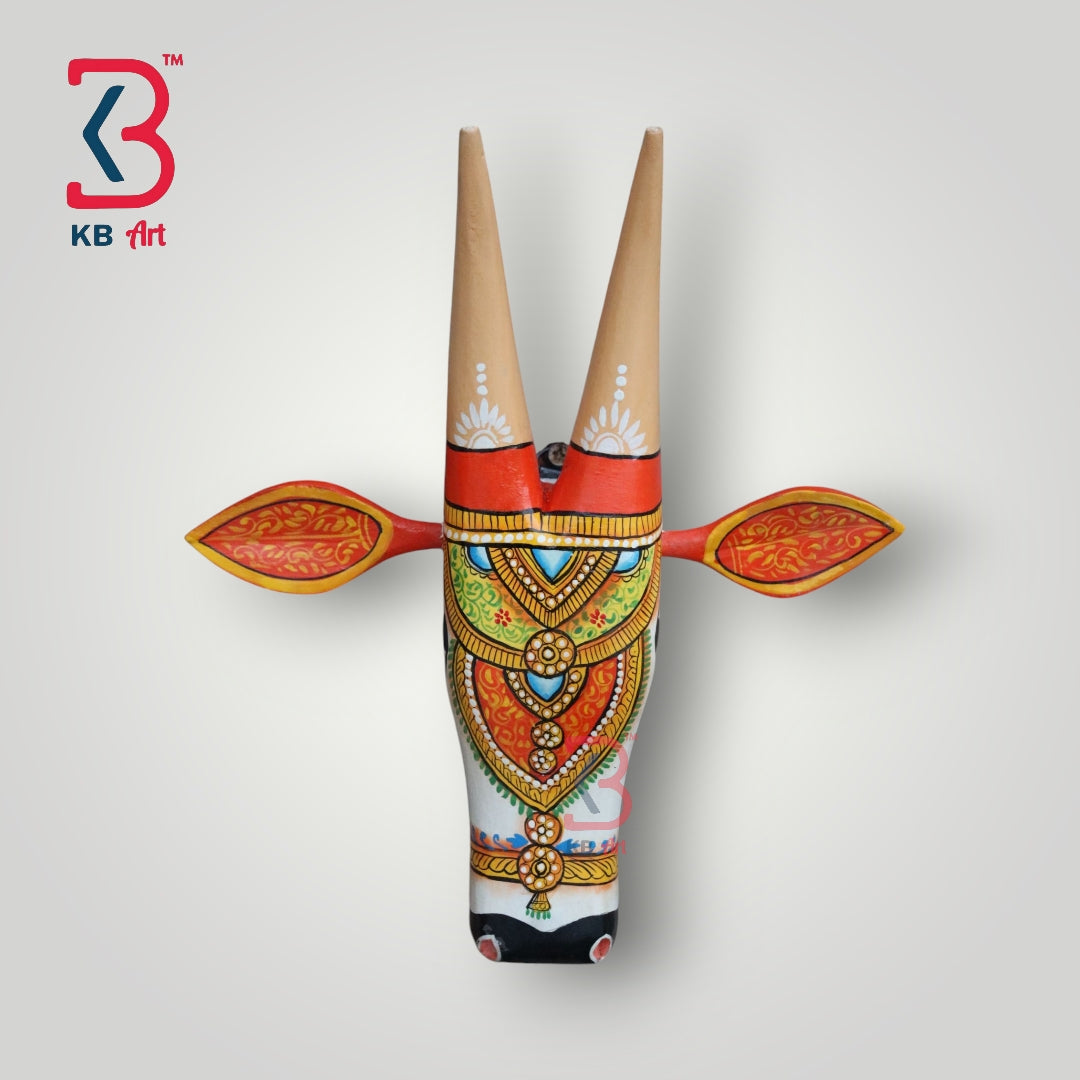 Hand-painted wooden cow head wall art with traditional Indian designs and long horns