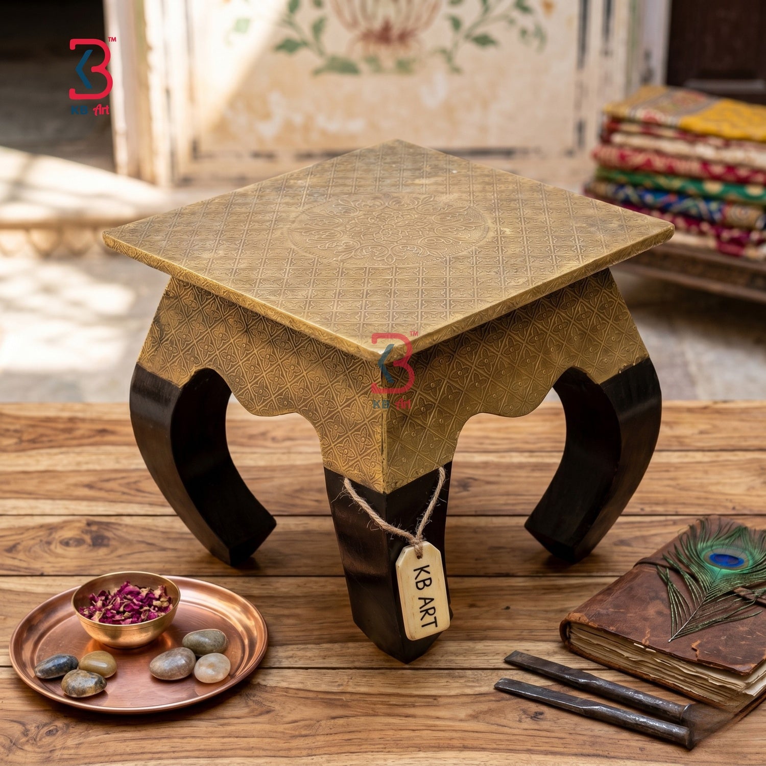 Decorative wooden stool with intricate design on a wooden surface, surrounded by decorative items.