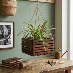 KB ART brown polished hanging wooden planters arranged at varied heights to create a lush tiered urban garden on a covered balcony patio.