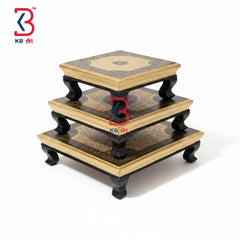 Three-tiered wooden stand with decorative patterns on a white background, featuring the KB Art logo.