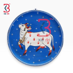 KB ART Decorative hand painted wood cow pichwai plate – styled home decor lifestyle view
