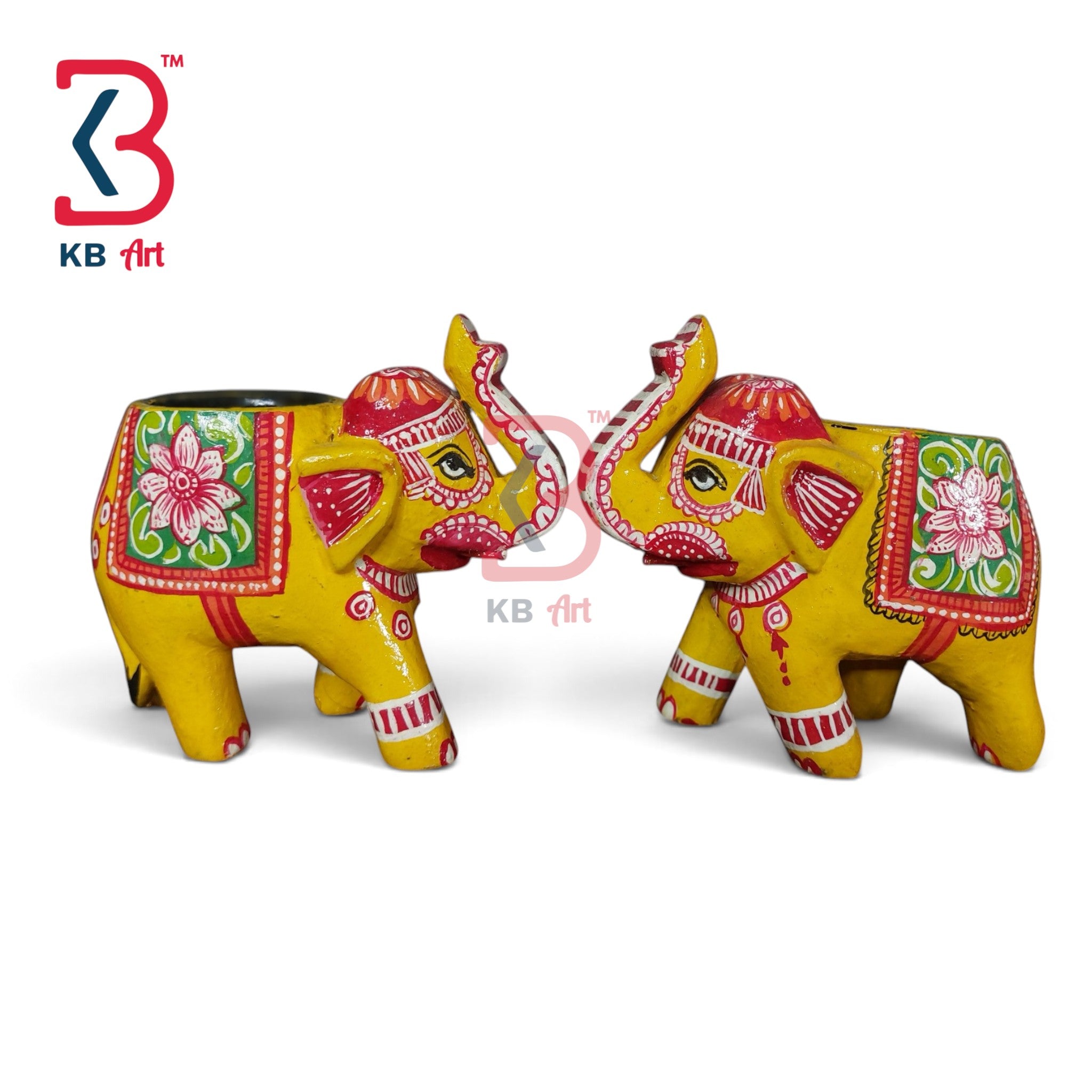 Two decorative elephant figurines painted in bright yellow with red, pink, green, and white floral and geometric patterns, shown on a white background with a KB Art logo in the top left.