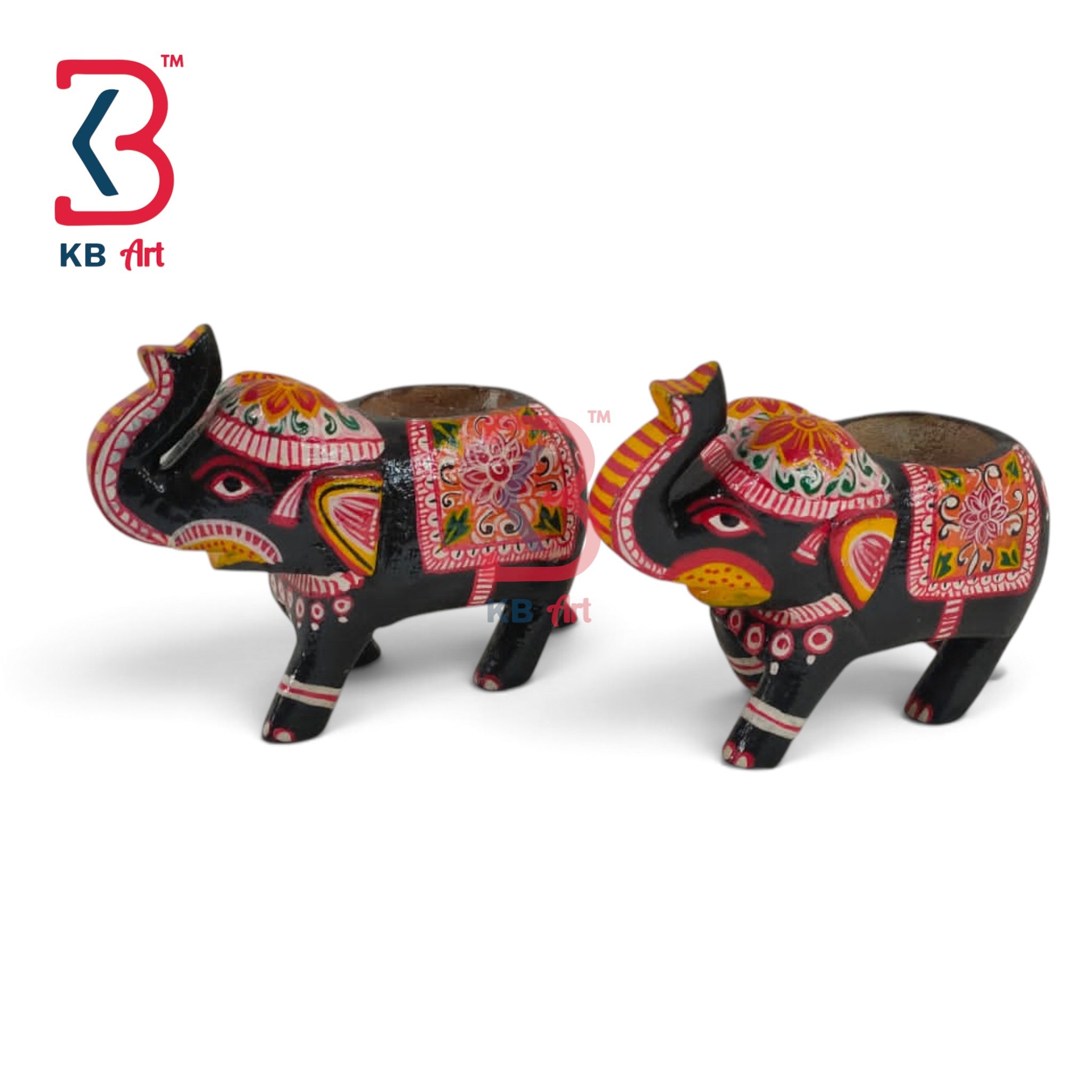 Two hand-painted Indian clay elephant flower pots on a white background, decorated with vibrant red, pink, yellow, and green patterns. A KB Art logo is visible in the top left corner.