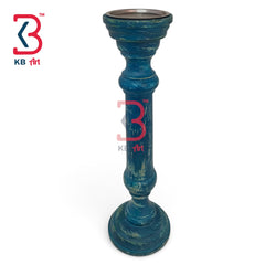 A distressed teal blue candlestick holder with a rustic, weathered finish and a silver metal rim at the top, shown on a white background with a KB Art logo overlay.