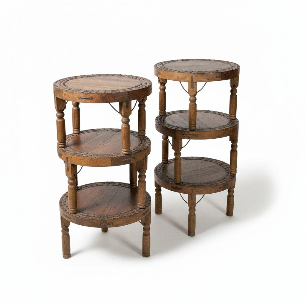 Set of three round wooden nesting side tables with three tiers each, featuring turned legs and decorative beaded trim around the circular shelves, shown on a white background.
