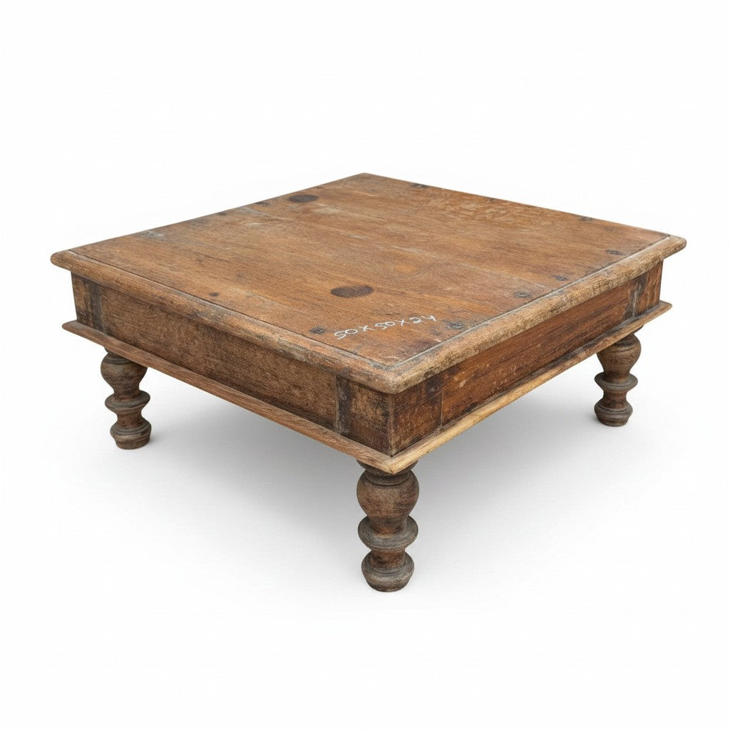 A rustic square wooden coffee table with a weathered brown finish and turned legs, shown on a plain white background.