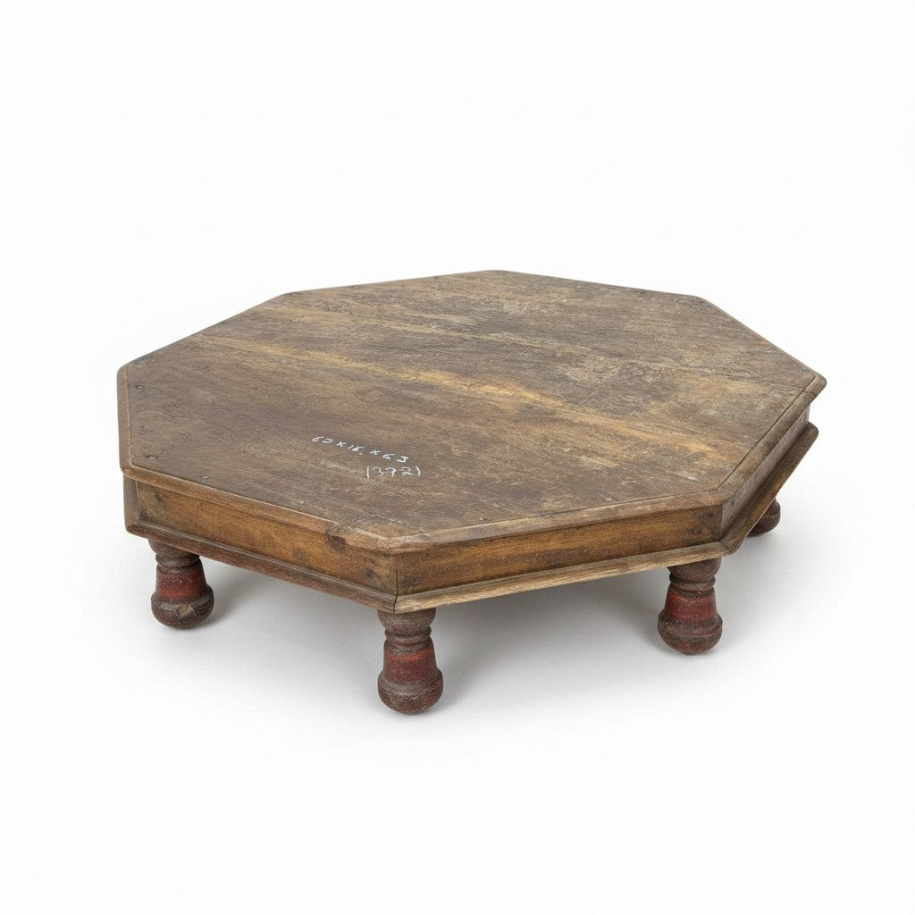 An octagonal wooden platform or low table with four turned legs, shown on a plain white background.