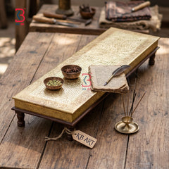 Vintage-style desk setup with books, inkwell, and quill on a wooden surface, featuring 'KB Art' branding.