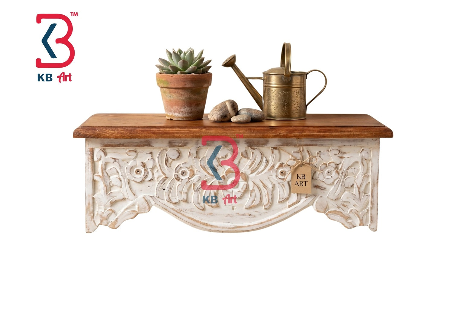 KB ART hand-carved ornate wooden wall shelf with a natural finish top and distressed white-washed floral base holding a succulent planter and a brass watering can.