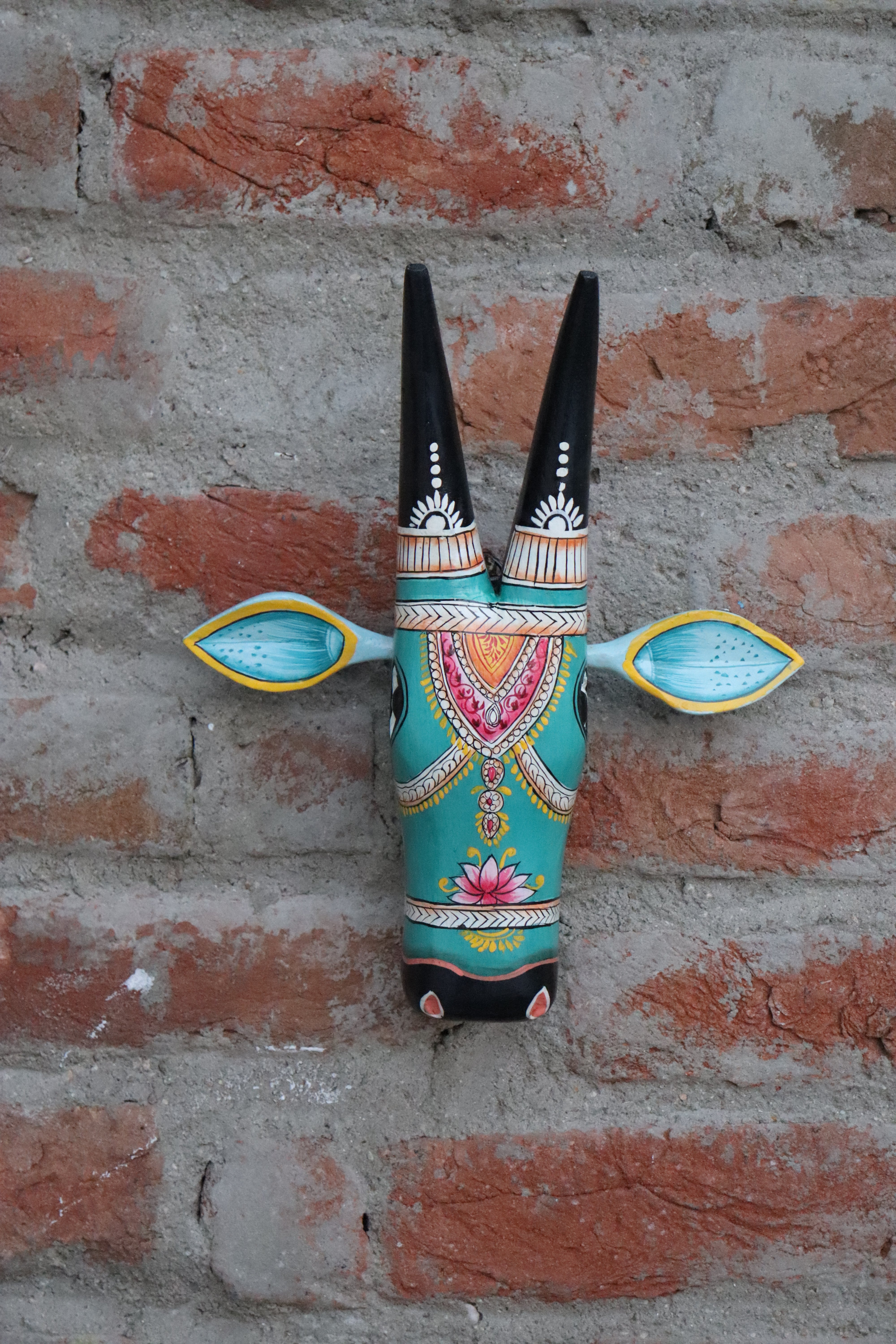 Traditional Indian folk art cow head, a unique and vibrant piece for cultural home decor.