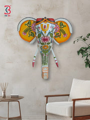 Colorful Indian-style wooden elephant mask featuring traditional patterns and a trunk, ideal for home decoration.
