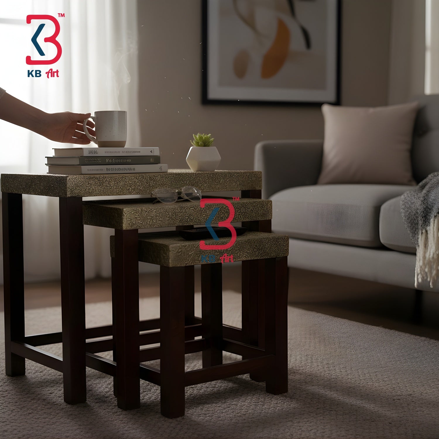 Nest of wooden tables in a living room setting with a hand placing a cup on top.