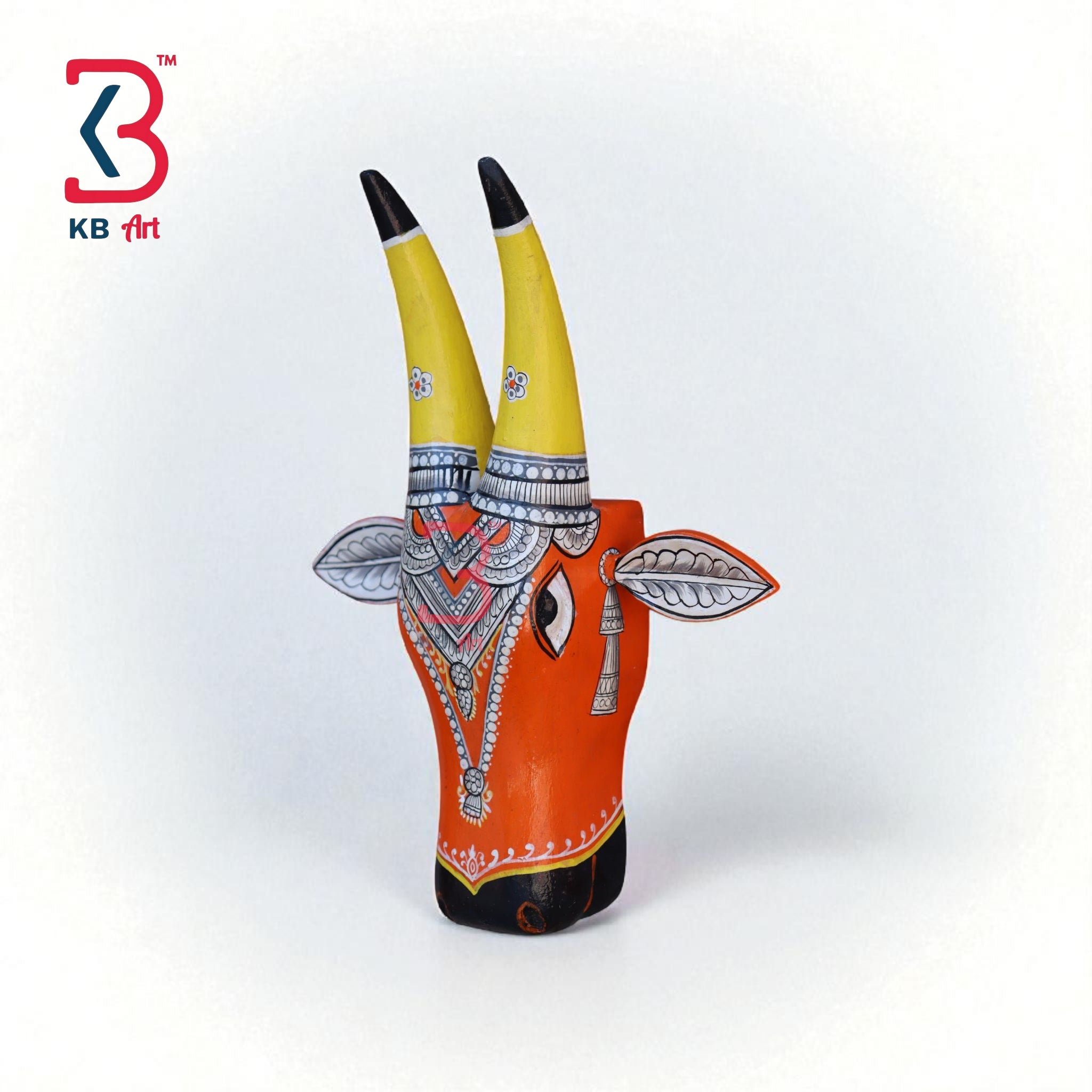 Decorative wooden bull head mask with vibrant colors and traditional Indian patterns, ideal for ethnic wall art.