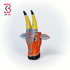 Decorative wooden bull head mask with vibrant colors and traditional Indian patterns, ideal for ethnic wall art.