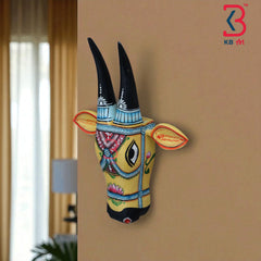 Artistic wooden bull head sculpture, perfect for cultural or bohemian home accents.