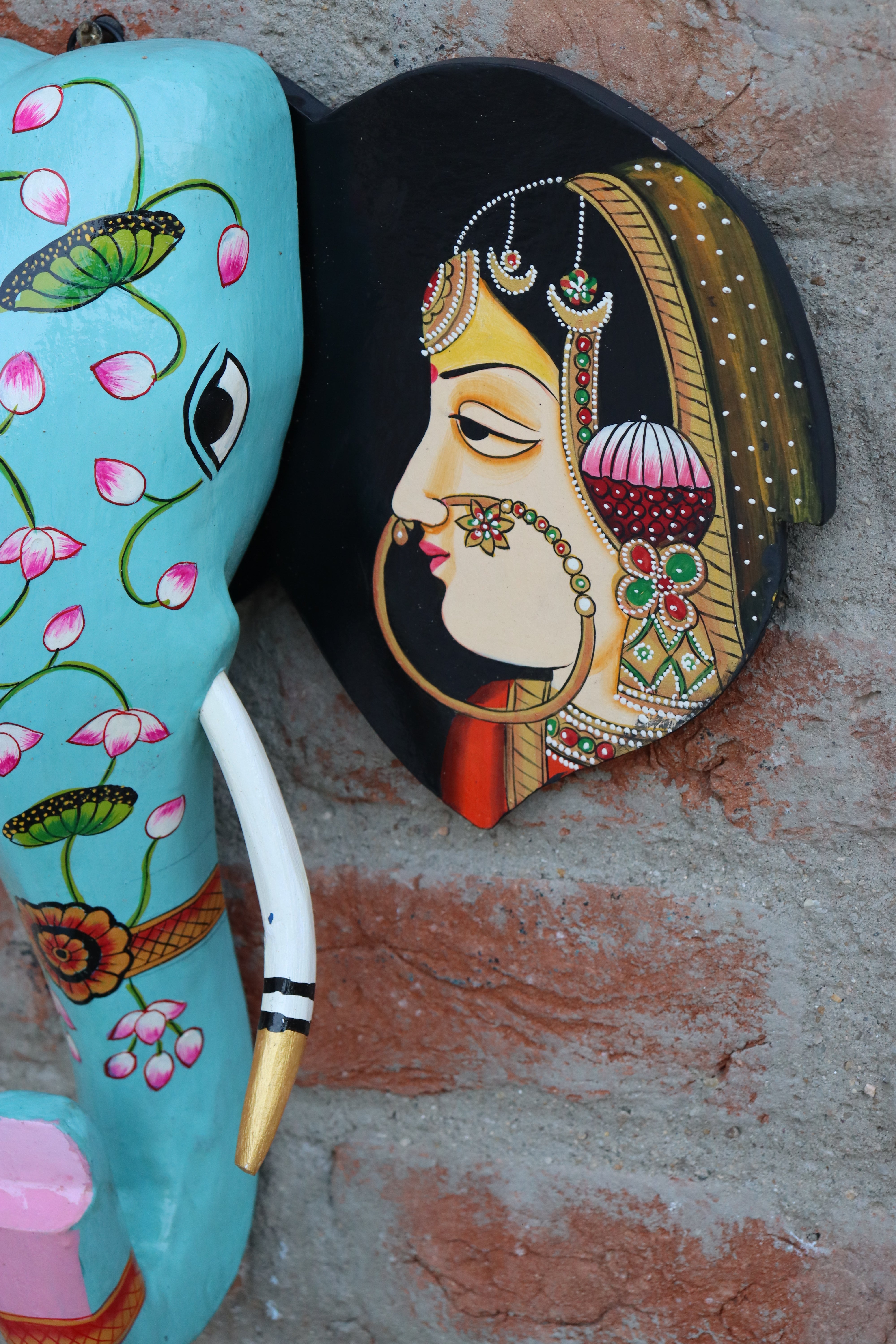 Unique carved wooden elephant head, ideal for bohemian or ethnic-themed interior design.