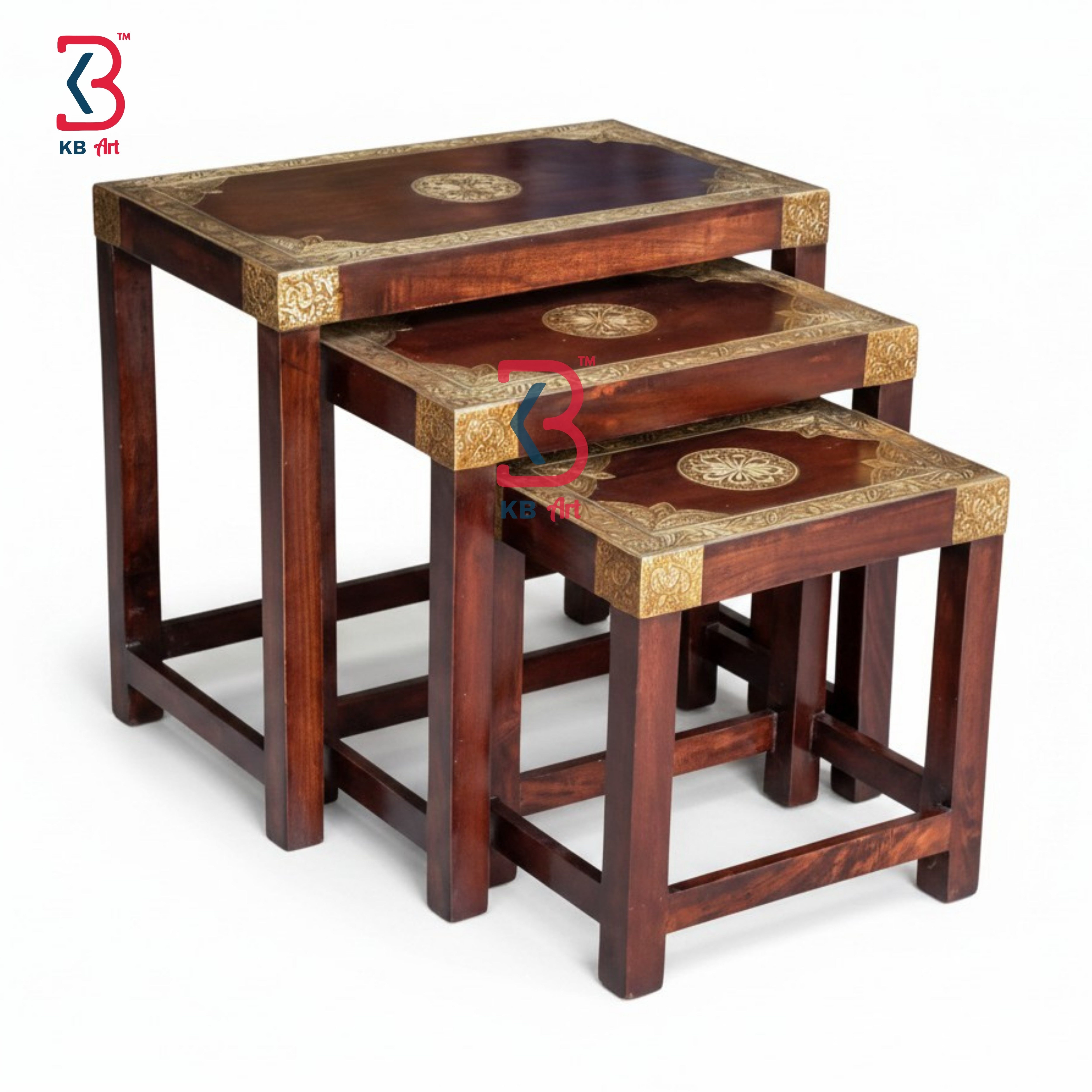 Set of three nested wooden tables with decorative patterns on a white background