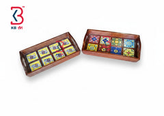 Two rectangular wooden serving trays with side handles, decorated with colorful mosaic tile patterns, shown on a white background with a KB Art logo in the top-left corner.