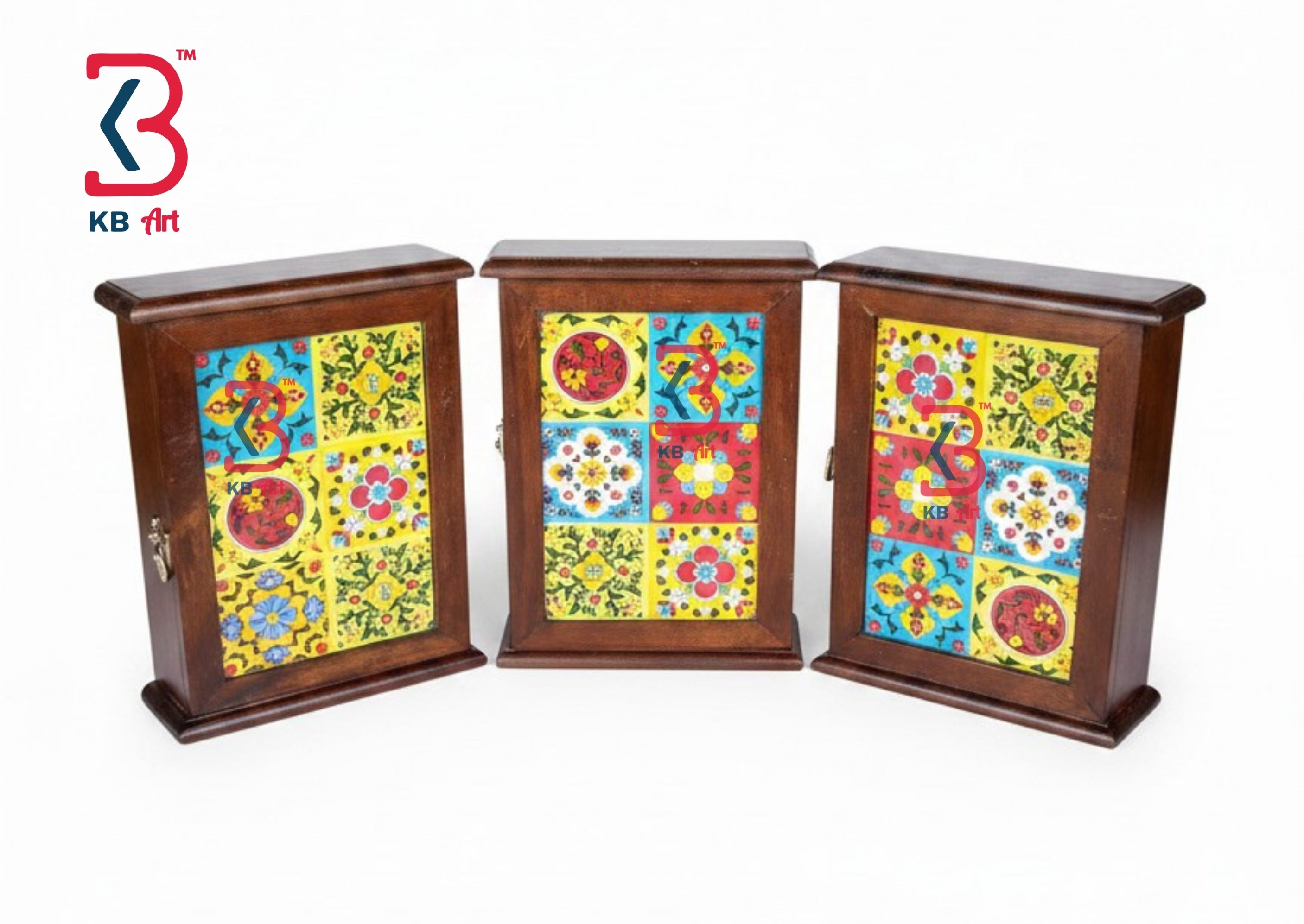 Three small wooden display cabinets with colorful hand-painted mosaic doors, shown on a plain white background. A KB Art logo is visible in the top-left corner.