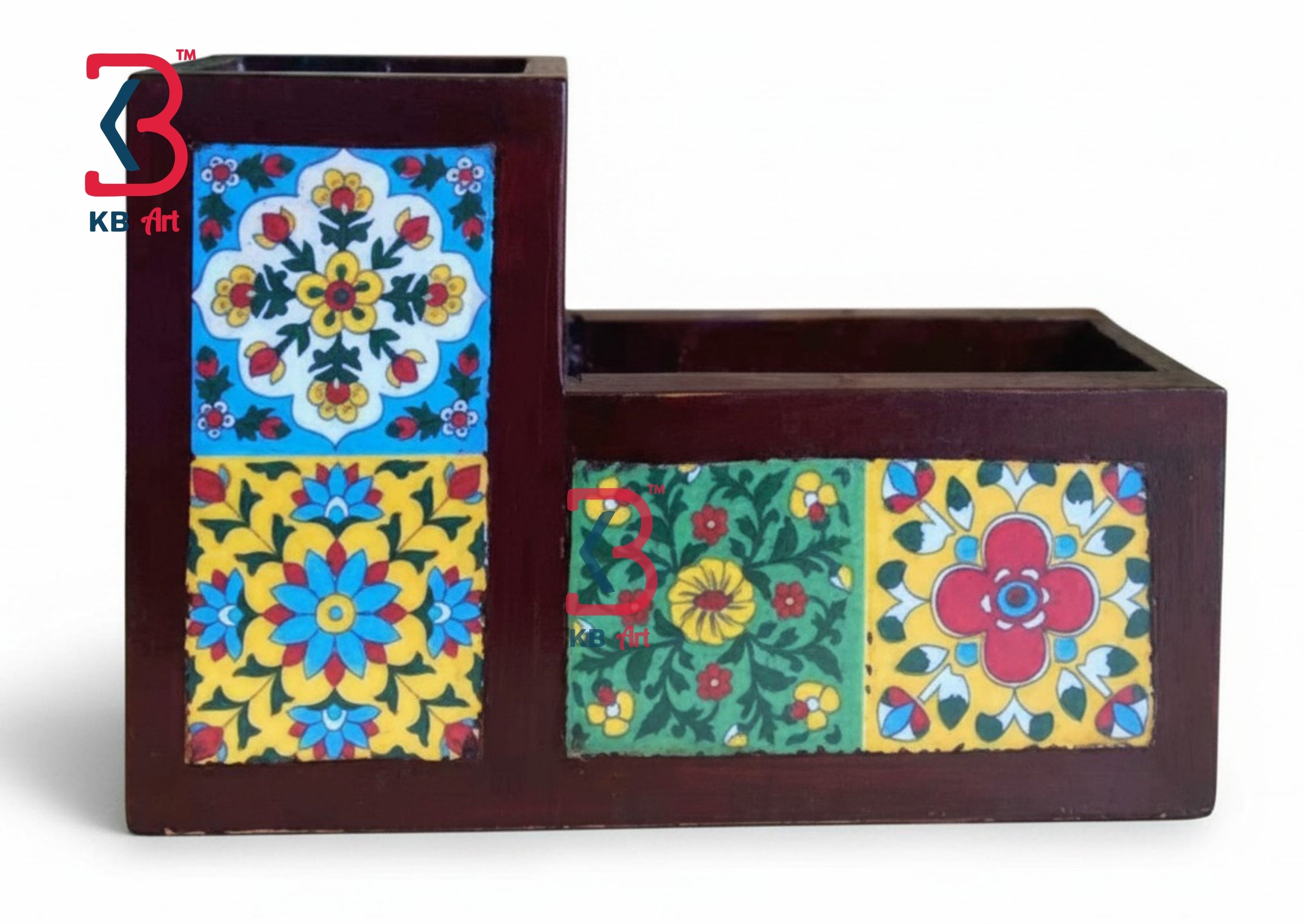 A dark brown wooden desk organizer with two compartments, decorated with colorful hand-painted floral and geometric tile patterns on the front panels, shown against a plain white background.