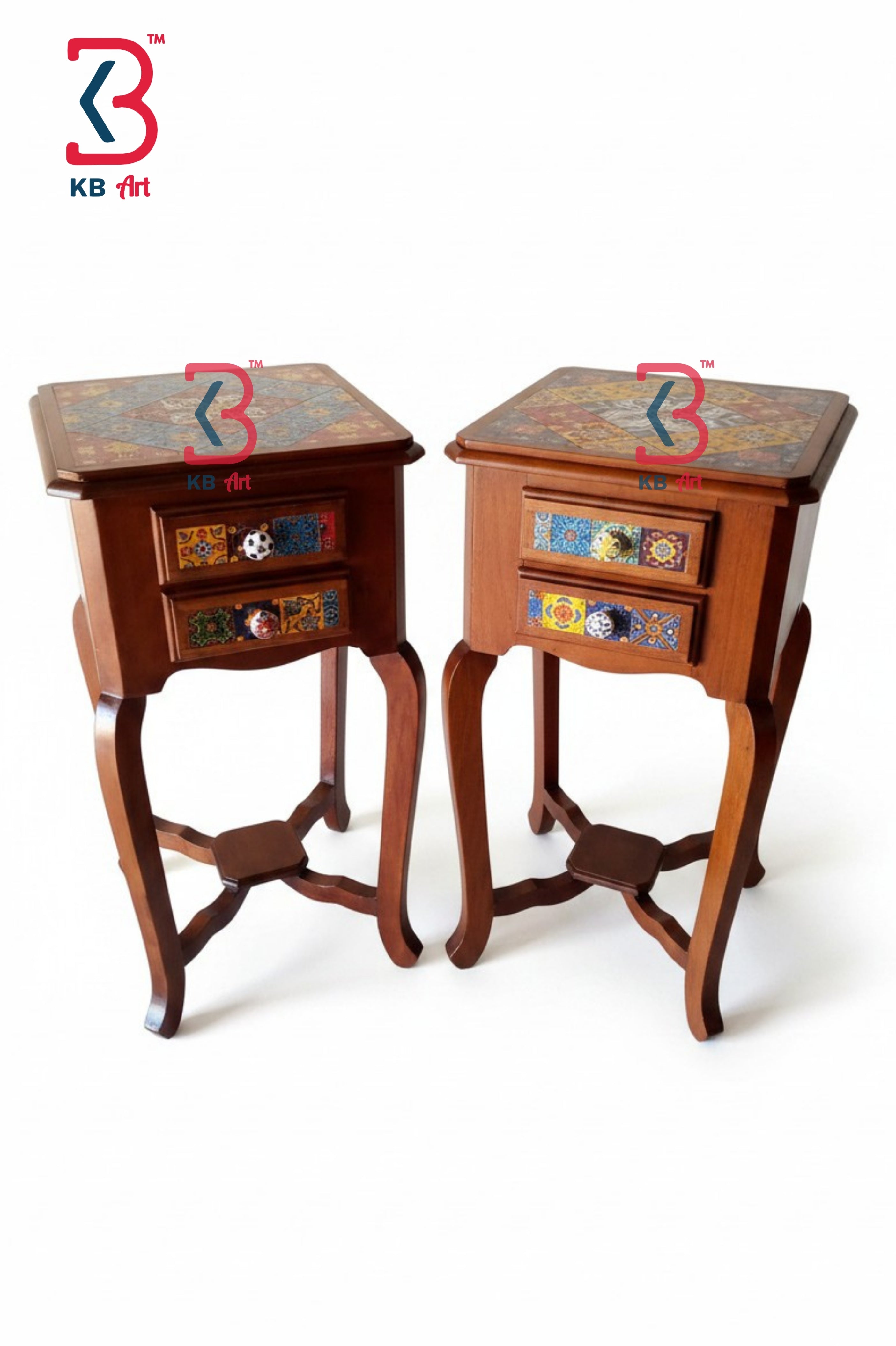 A pair of small wooden side tables with two drawers each, featuring colorful hand-painted floral patterns on the tabletops and drawer fronts, set against a plain white background.