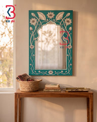 Handpainted wooden mirror with teal arch frame and lotus floral design