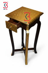 Wooden side table with a drawer on a white background, featuring the KB logo.