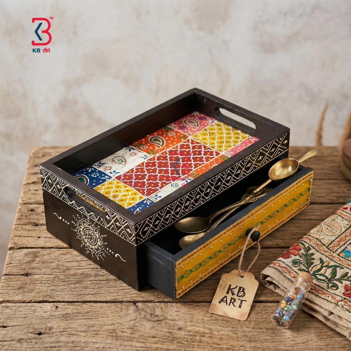 Real product photograph on a white background showing a dark brown handmade wooden serving tray with its hand-painted yellow drawer slightly open, by KB Art.